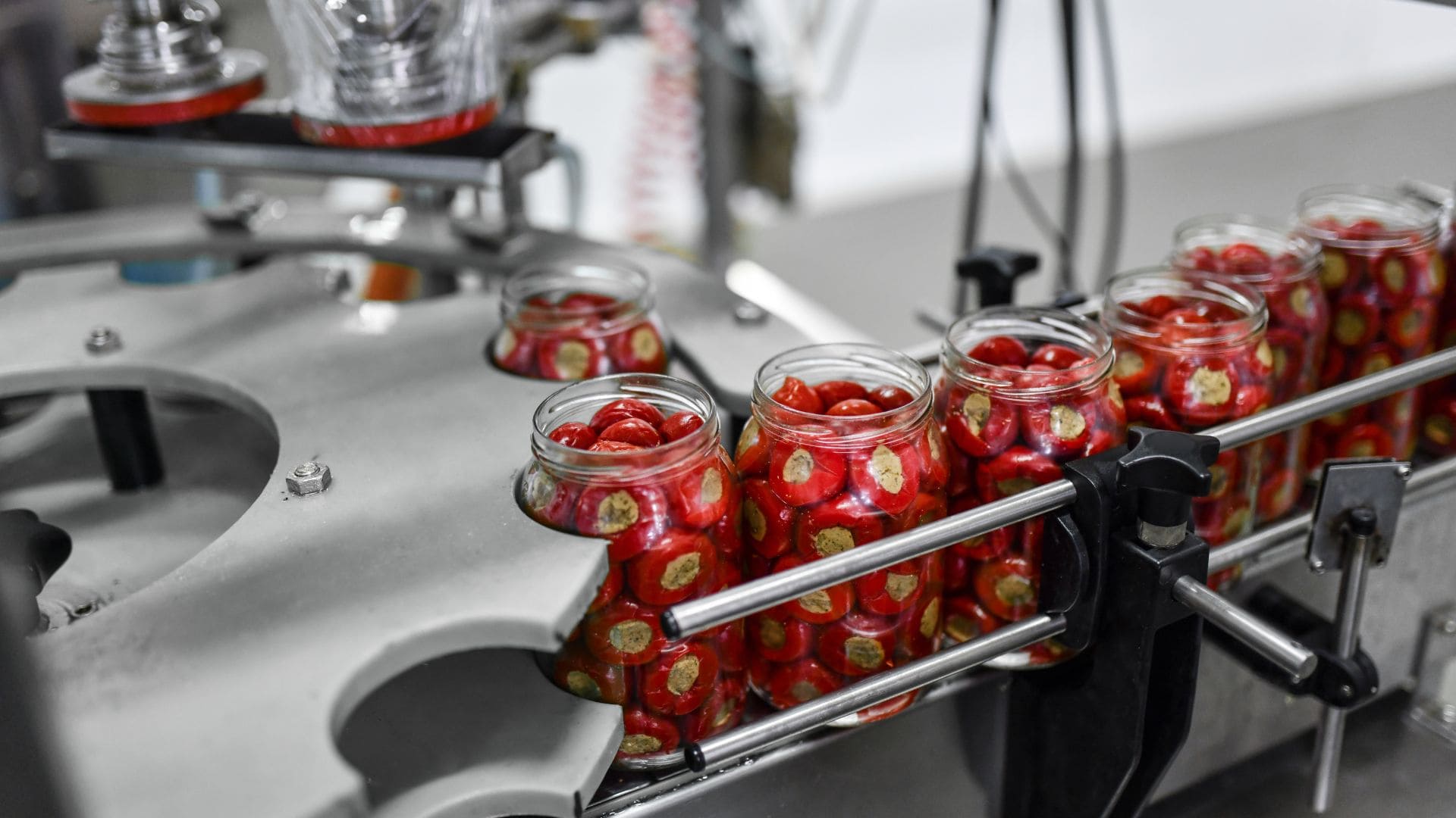 Machine preserving stuffed cherry peppers